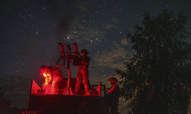 With men at the front lines, women watch over Ukraine’s night sky for Russian drones