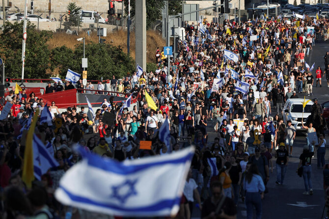 People attend a demonstration calling for the immediate return of hostages held in Gaza.