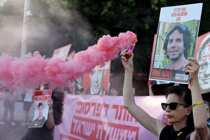 Protesters block a main road to show support for the hostages who were kidnapped during the deadly October 7 attack, in Tel Aviv