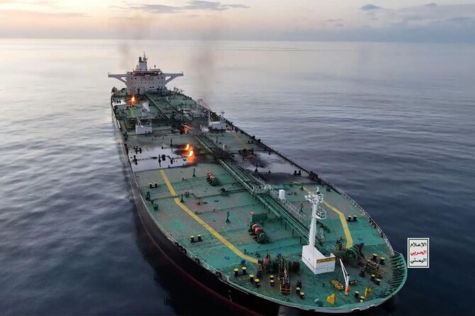 Yemen’s Houthis suspected of firing missiles at a container ship as an oil tanker burns