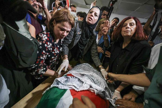 Activists mourn the body of slain Turkish-American activist Aysenur Ezgi Eygi at the Rafidia hospital morgue in Nablus.