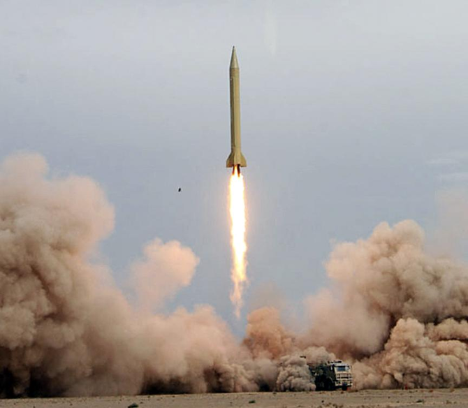 An Iranian Shahab-3 missile rises into the air after being test-fired at an undisclosed location in the Iranian desert. (AFP)