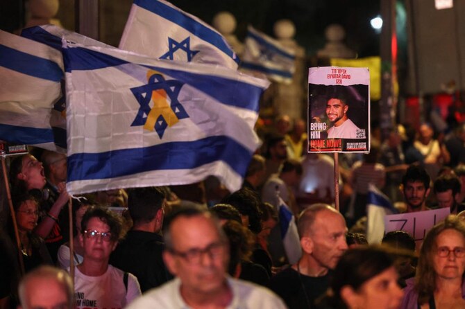 Supporters of Israelis held hostage by Palestinian militants in Gaza since October rally near the residence of the Israeli PM.