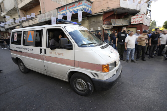 An ambulance believed to be carrying wounded people, after multiple explosions were heard in Beirut on Wednesday.