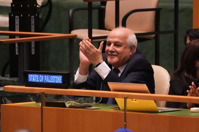 Palestinian representative Riyad Mansour applauds the result of the vote at UN Headquarters on September 18, 2024 in New York. 