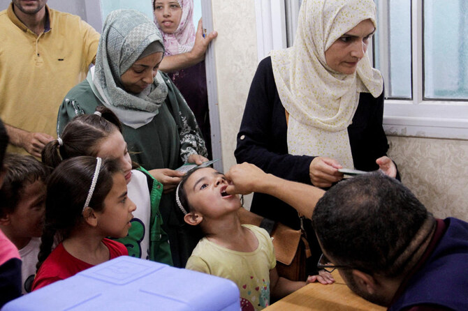 A Palestinian child is vaccinated against polio in Jabalia in northern Gaza Strip, September 10, 2024. (Reuters)