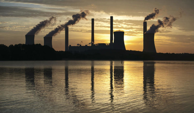 The coal-fired Plant Scherer stands in the distance in Juliette, Ga., on June 3, 2017. (AP)