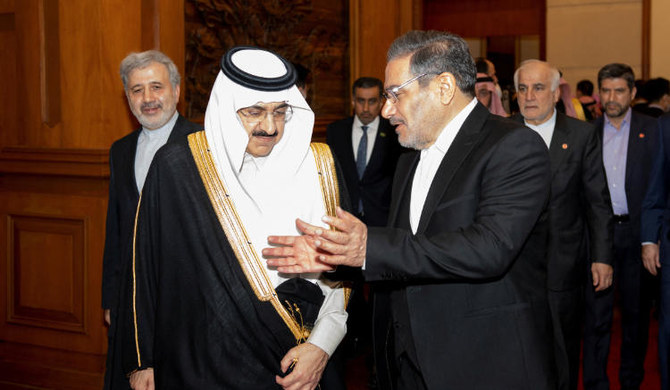 Iran's Ali Shamkhani talks with Saudi minister Musaad bin Mohammed Al Aiban during a meeting in Beijing. (REUTERS)