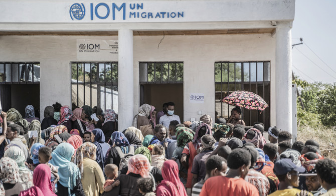 Refugees who crossed from Sudan to Ethiopia wait in line to register at IOM in Metema, on May 4, 2023. (AFP)