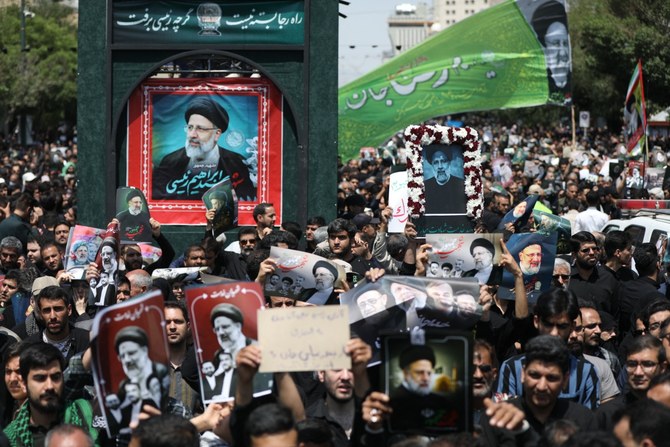 Iranian mourners attend the funeral of late president Ebrahim Raisi. May 23, 2024 (File/AFP)