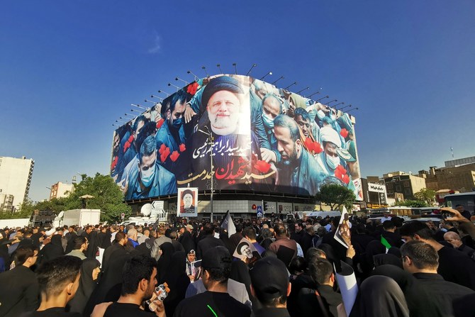 Mourners attend the funeral of Iranian President Ebrahim Raisi, in Tehran. May 22, 2024 (File/AFP)