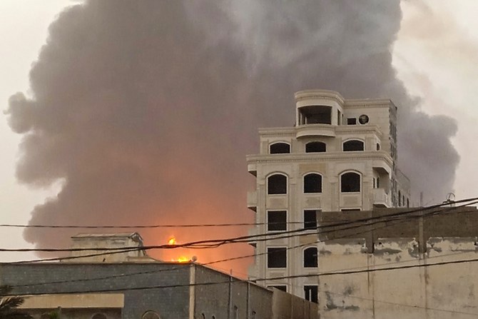 A huge column of fire erupts following Israeli strikes in Hodeidah. July 20, 2024 (File/AFP)