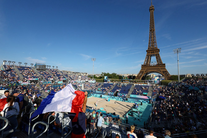 General view of the Eiffel Tower Stadium shows spectators in the stands with the French flag. (Reuters)