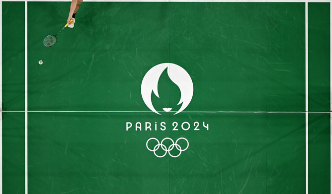 An athlete plays a shot in the men's singles badminton during the Paris 2024 Olympic Games in Paris on August 5, 2024. (AFP)