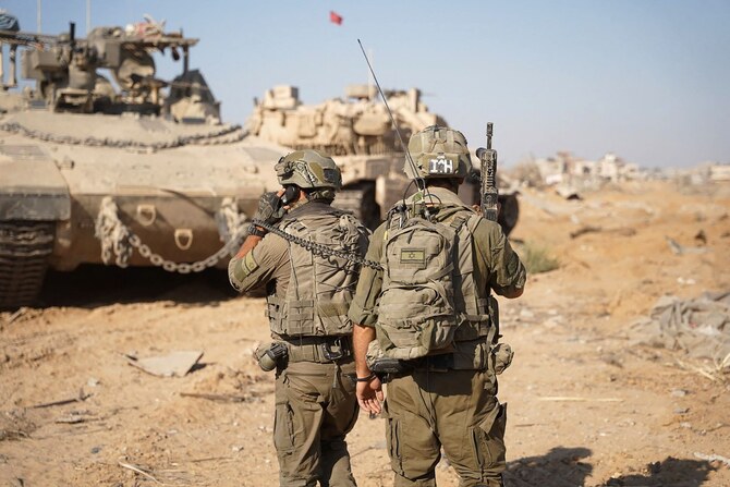 Israeli troops and armoured vehicles operating on the ground in the Gaza Strip. (Reuters/Handout/Israeli Army)