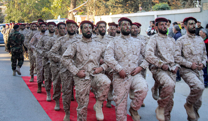 Fighters of the Lebanese Shiite movement Hezbollah marching during a military parade in the city of Baalbek in Lebanon. (AFP)