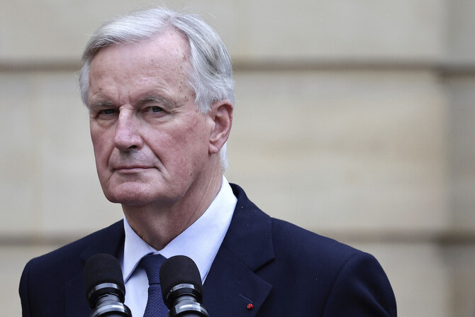 New French prime minister Michel Barnier looks on during the handover ceremony. (AP)