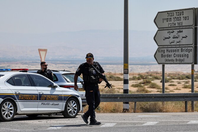 Israeli security forces gather at the scene of an attack near the Allenby Crossing. September 8, 2024 (File/AFP)