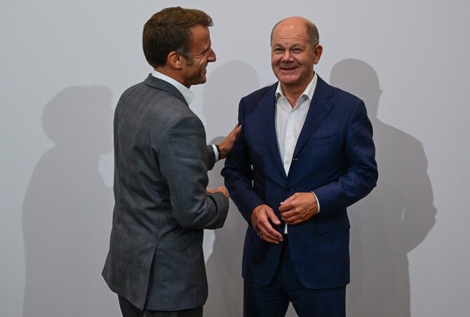 It remains unclear if Macron and Scholz can enhance their domestic political positions. (AFP)