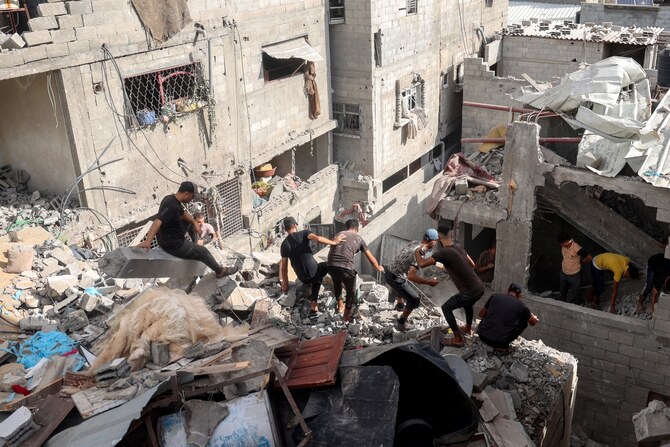 Palestinians check the rubble of a house following Israeli bombardment in Nuseirat, central Gaza Strip. Sept. 16, 2024 (AFP)