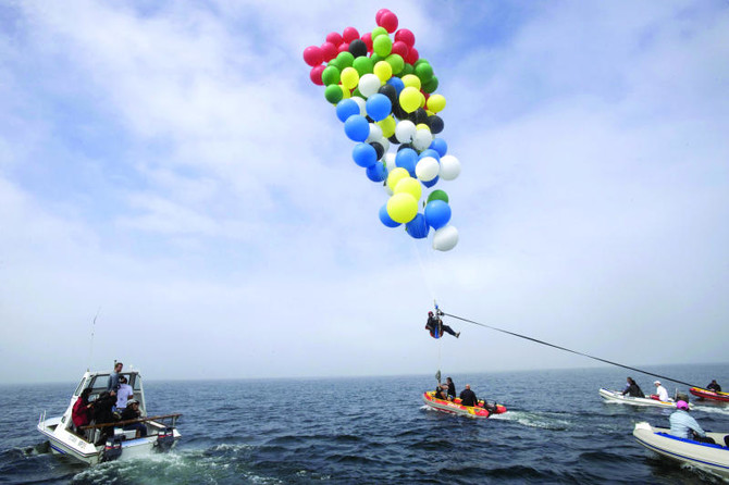 Man uses balloons to fly from Mandela prison to Cape Town