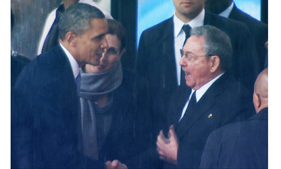 World bids farewell to Nelson Mandela; Obama and Raul Castro shake hands