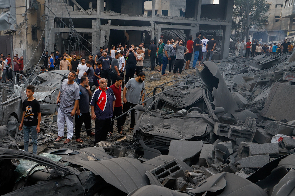 Palestinians inspect damages in the aftermath of Israeli strikes at Beach refugee camp in Gaza City on Oct. 9, 2023. (Reuters)