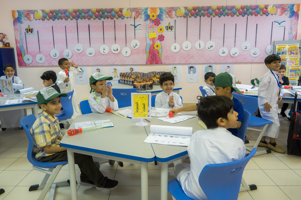 Women teach young boys for the first time in Saudi public schools